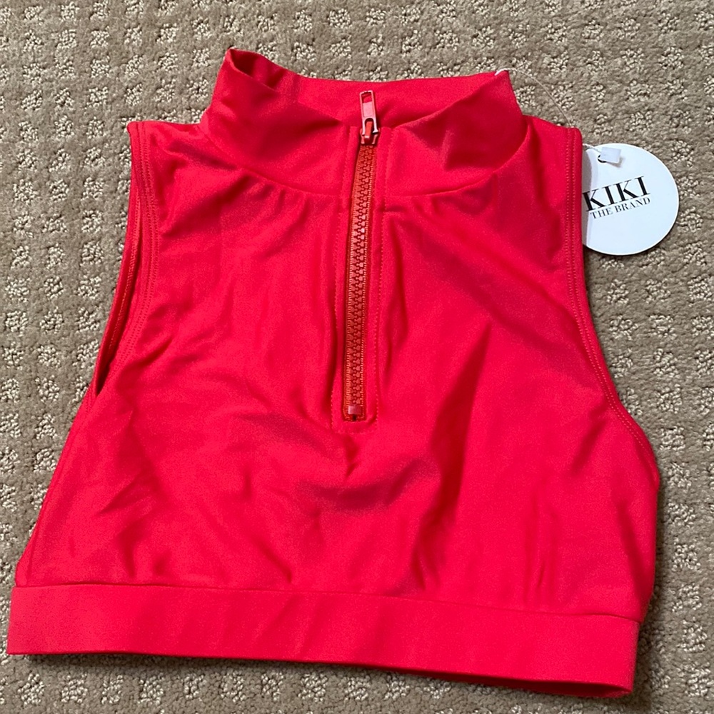 Sleeveless zipper front crop top by Kiki the brand.